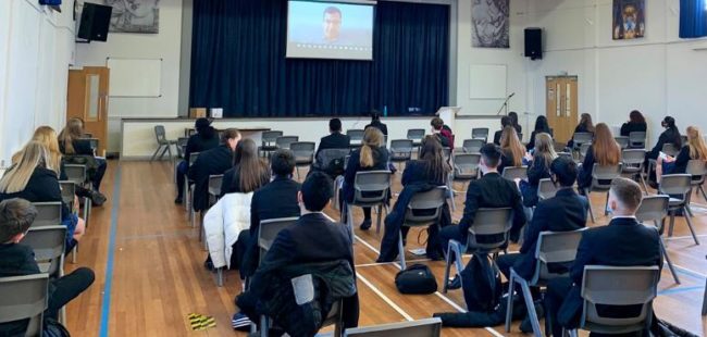 Kids in school assembly hall