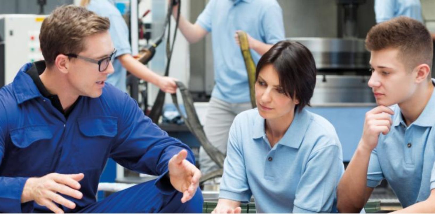 Engineer with apprentices