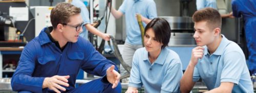 Engineer with apprentices