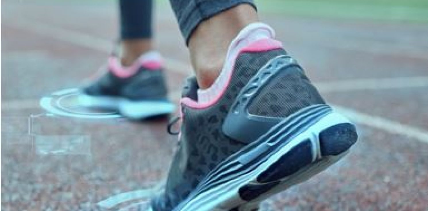 A picture of some running shoes at a starting line in a race