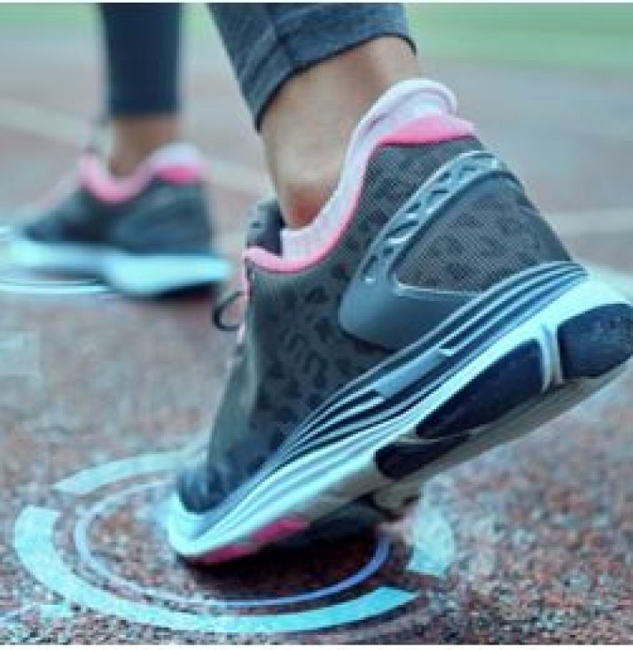 A picture of some running shoes at a starting line in a race